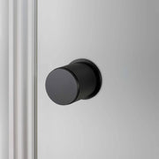 Buster + Punch Cross deurknop op rozet (draaibaar) black – vooraanzicht