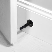Buster + Punch Cross deurstopper wandmontage black - vooraanzicht