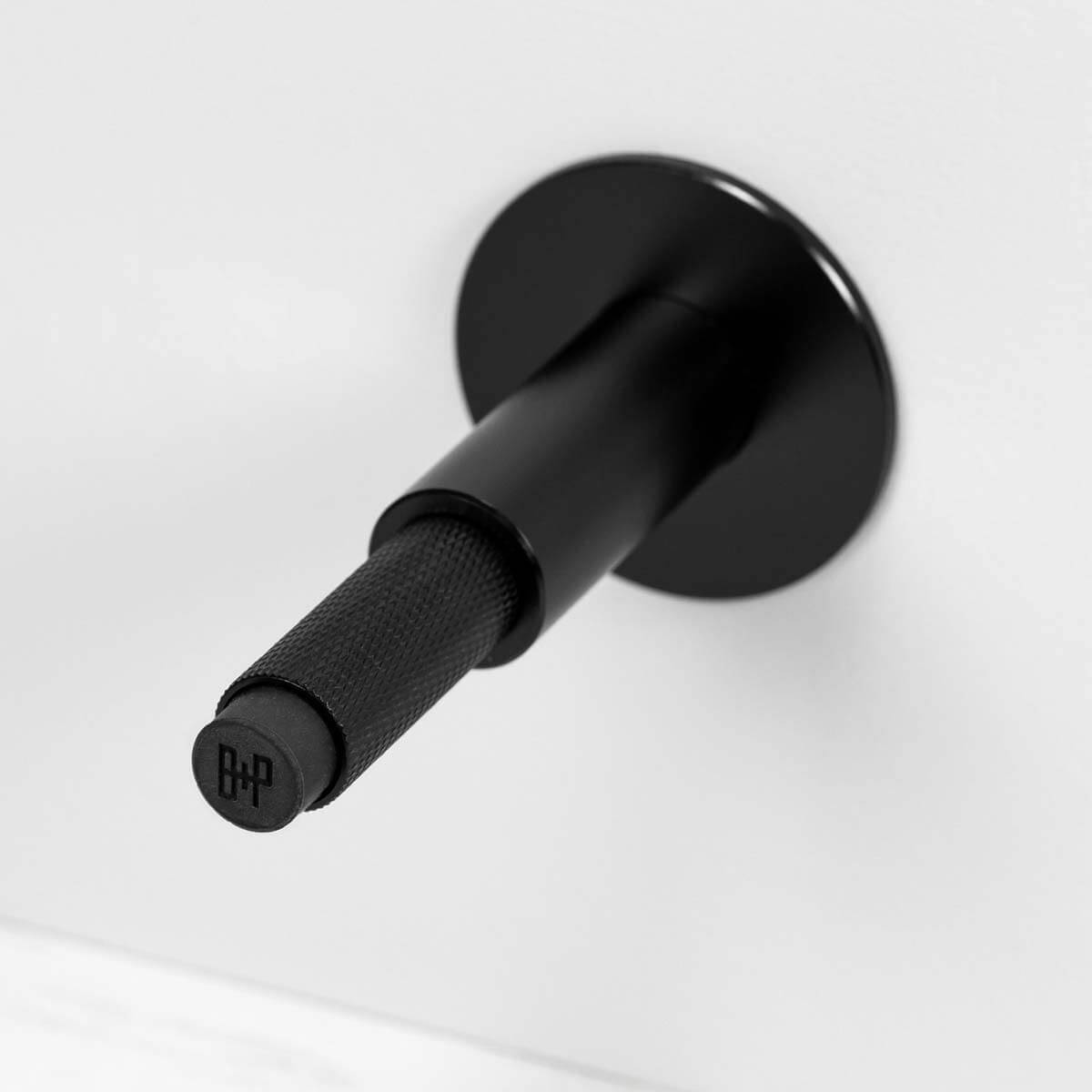 Buster + Punch Cross deurstopper wandmontage black - detail