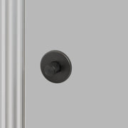 Buster + Punch Cross thumbturn WC-slot in smoked bronze, vooraanzicht